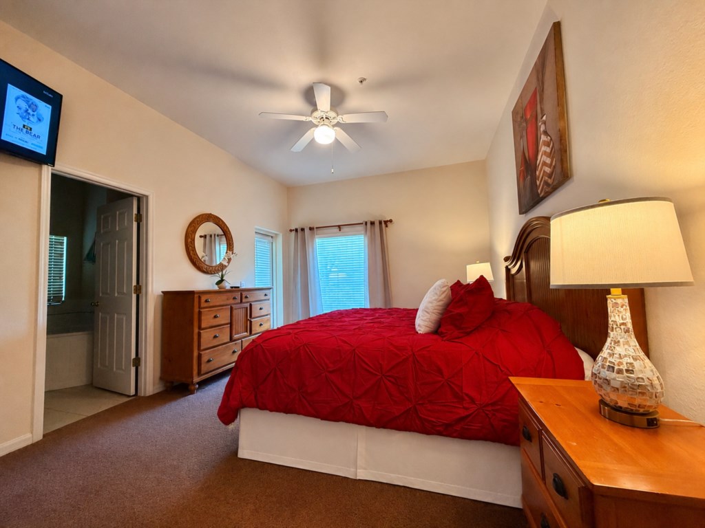 Wake up refreshed in the peaceful primary bedroom.

