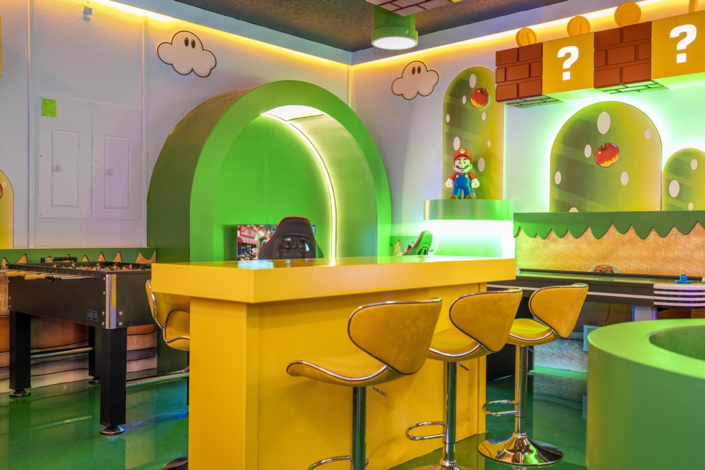 Mario Bros themed game room w/ arcade, Xbox, foosball.