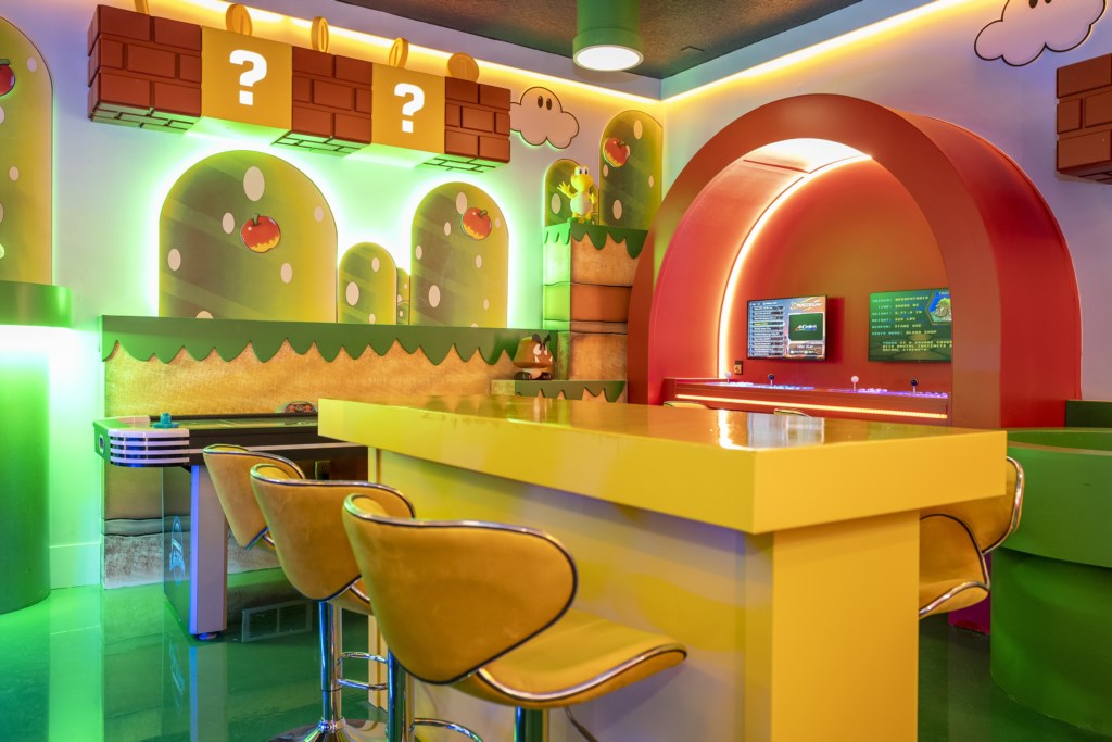 Mario Bros themed game room w/ arcade, Xbox, foosball.