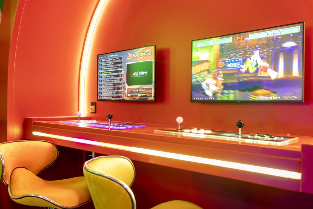 Mario Bros themed game room w/ arcade, Xbox, foosball.