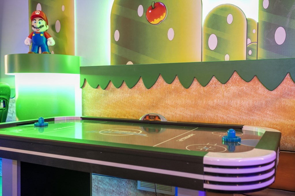 Mario Bros themed game room w/ arcade, Xbox, foosball.