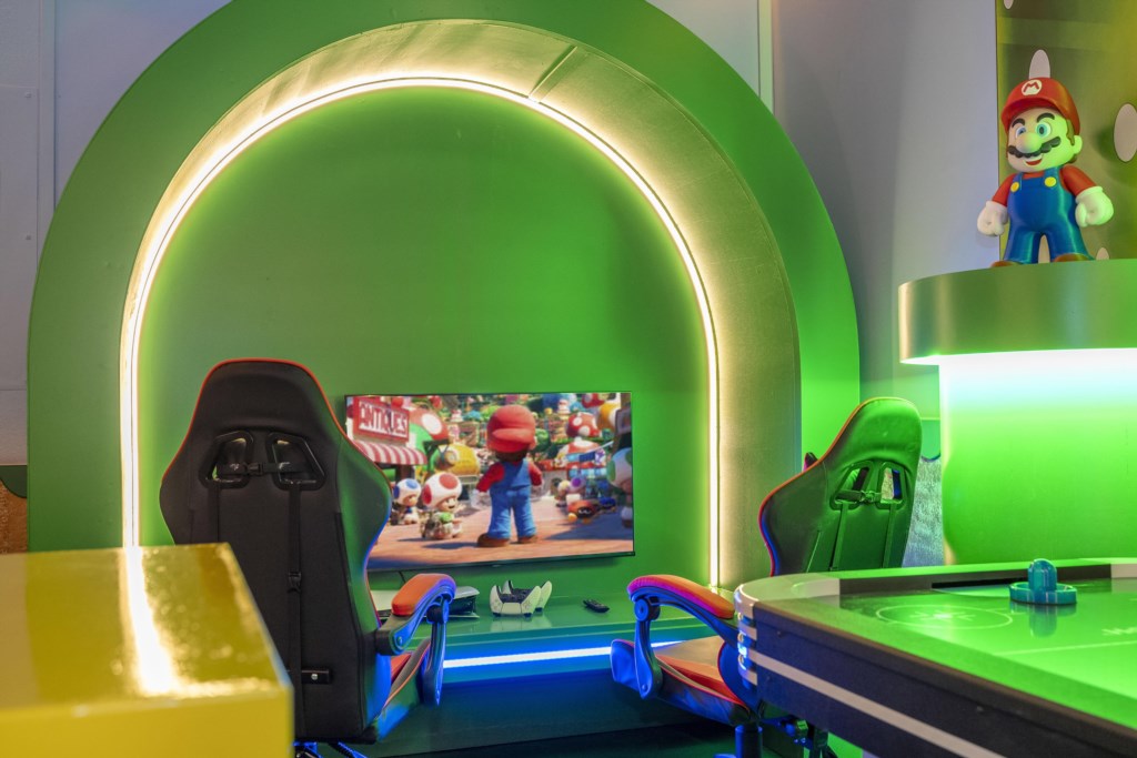 Mario Bros themed game room w/ arcade, Xbox, foosball.