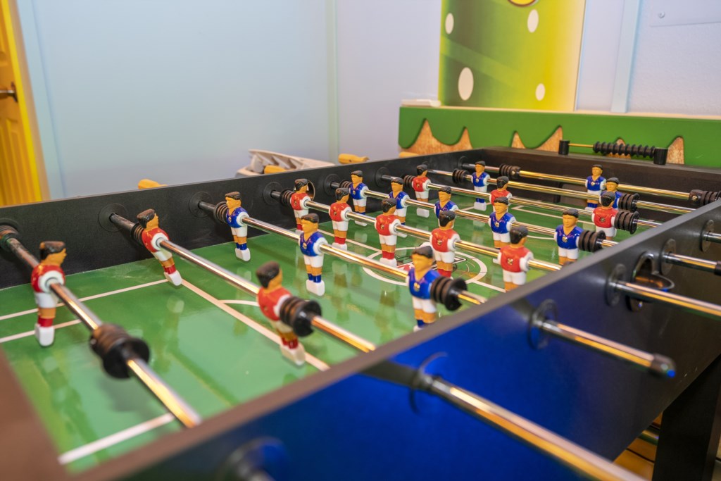 Mario Bros themed game room w/ arcade, Xbox, foosball.