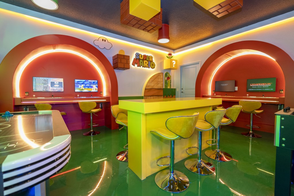 Mario Bros themed game room w/ arcade, Xbox, foosball.