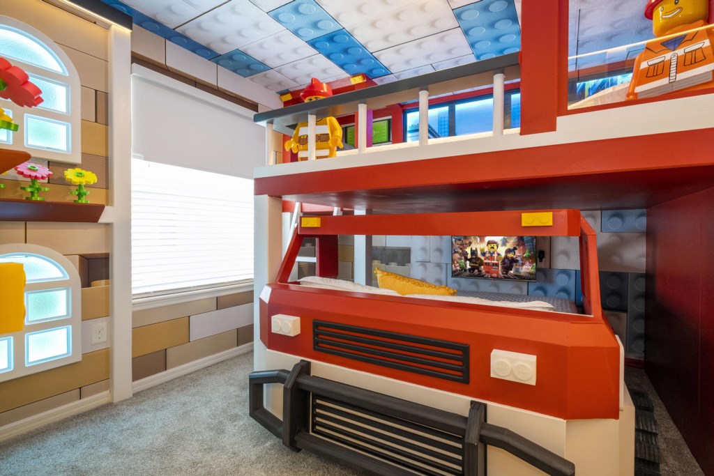 Lego Themed bedroom w/ slide to the loft, flat screen TV & bunk bed full over full