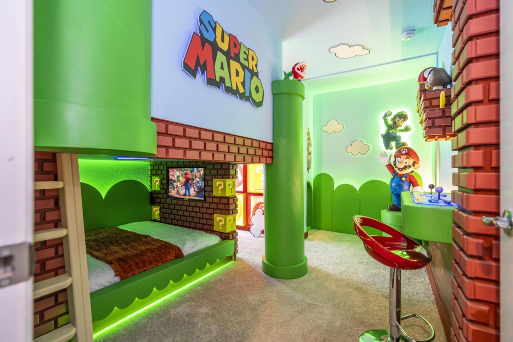 Super Mario Themed bedroom w/ TV and full over full beds.