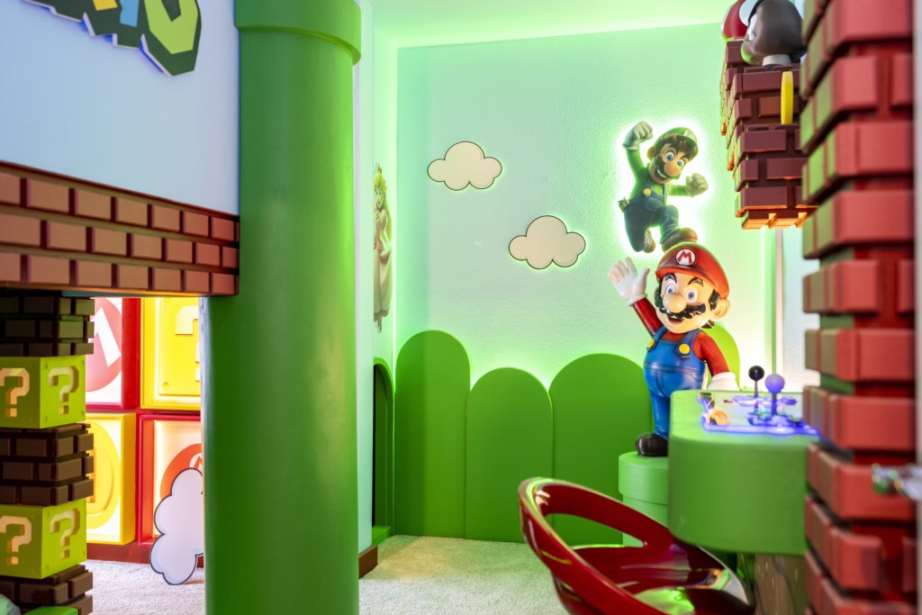Super Mario Themed bedroom w/ TV and full over full beds + arcade.