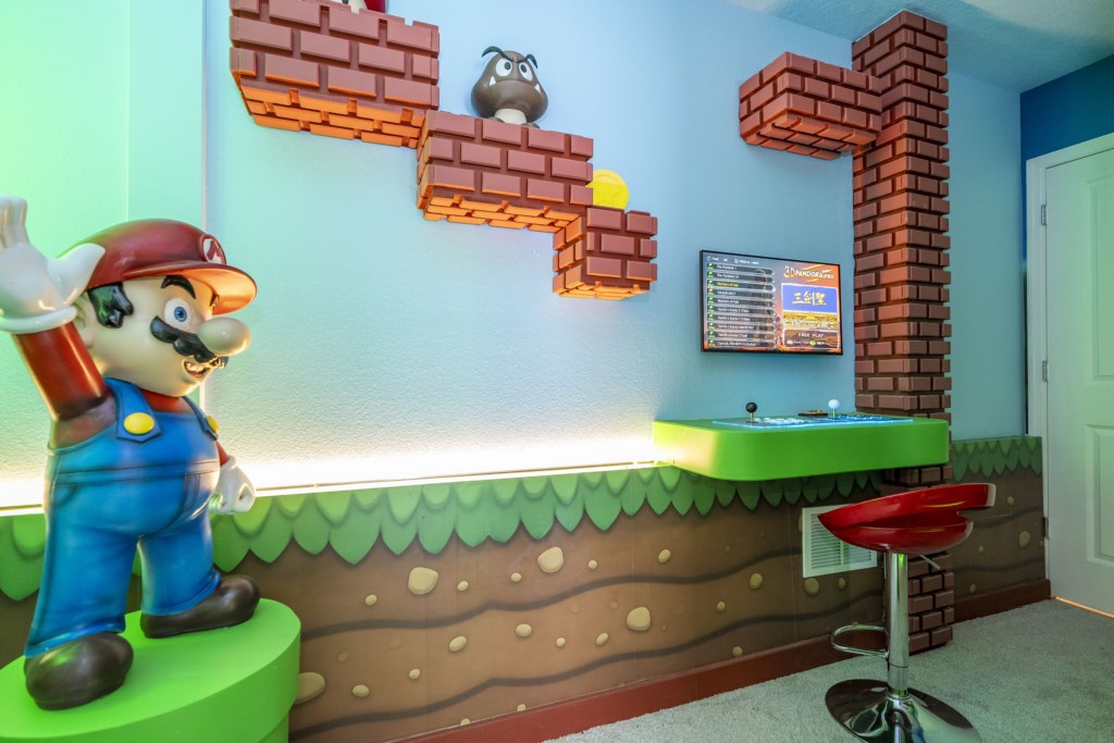 Super Mario Themed bedroom w/ TV and full over full beds.