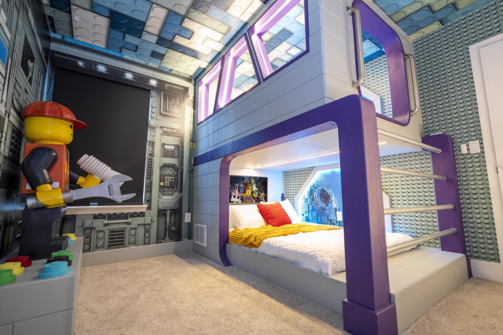 LEGO Themed bedroom w/ TV and full over full beds.