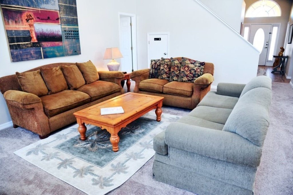 Relax on any of the three comfortable sofas in the living area, perfect for unwinding after a long day of exploring.