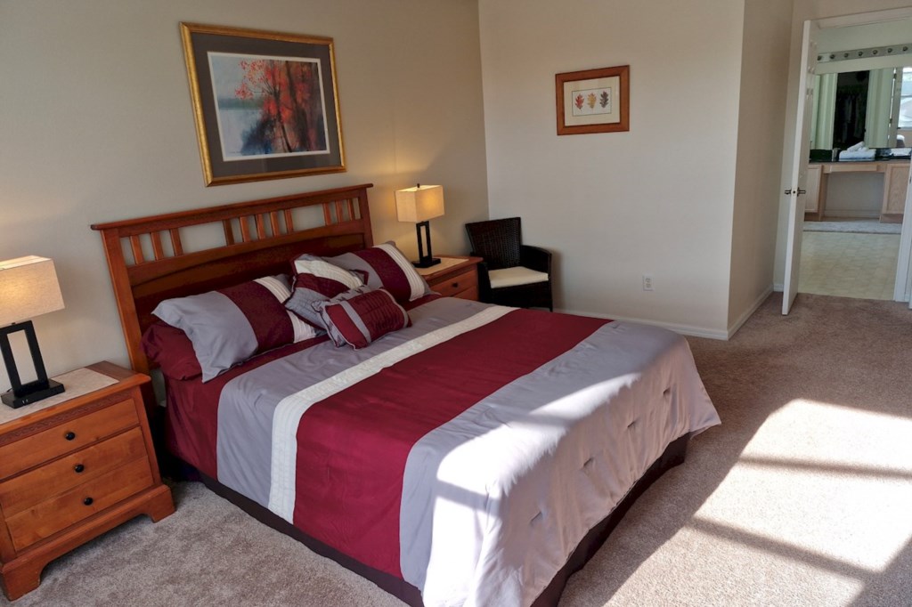 Master suite featuring direct access to a private ensuite bathroom and a spacious walk-in closet for added convenience.