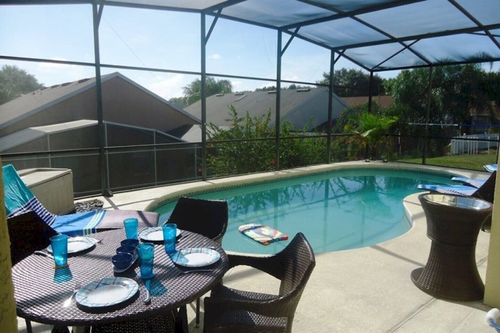 Private pool area featuring comfortable sun loungers and an inviting outdoor 