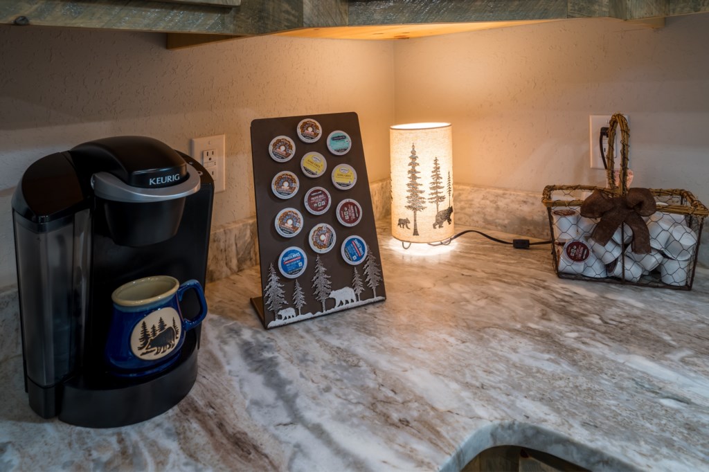 Cozy coffee nook with Keurig and a variety of pods for your morning brew.