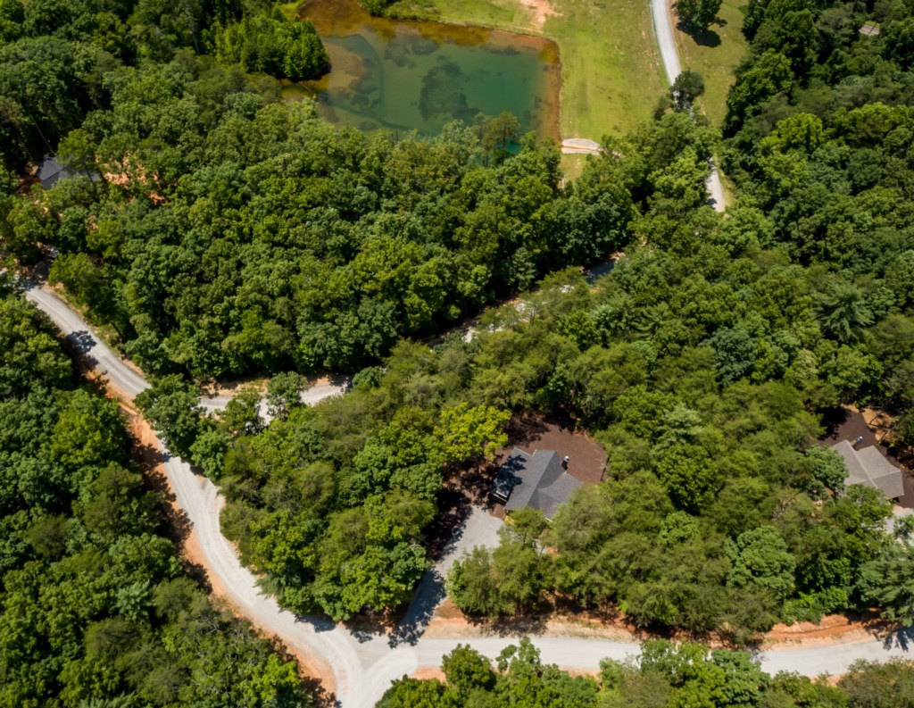 Secluded woodland retreat with private pond and scenic trails.
