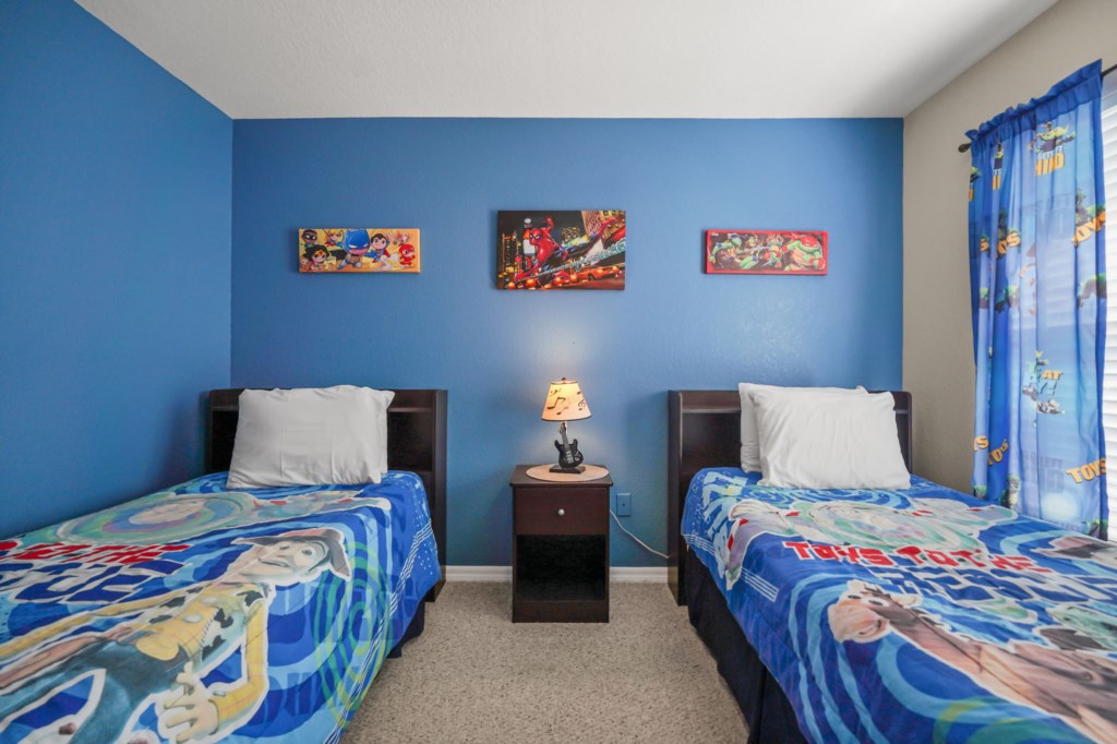 Bedroom # 3 upstairs with 2 Twin size beds in a Disney Toy Story Themed.