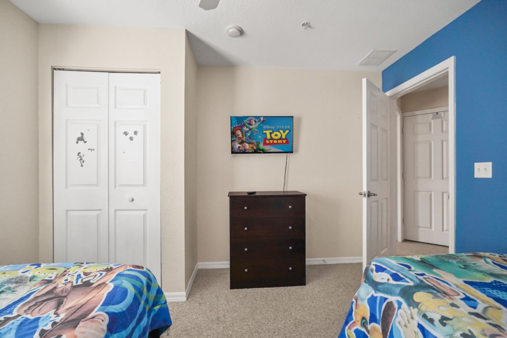 Bedroom # 3 upstairs with 2 Twin size beds in a Disney Toy Story Themed & Smart TV.