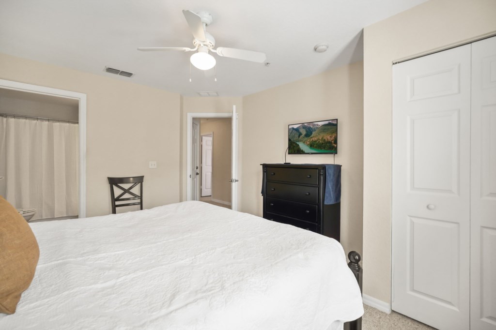Bedroom # 2 upstairs with a King size bed & Smart TV.