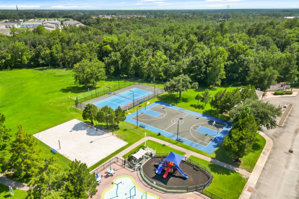 Resort community basketball court, tennis court, sand volleyball court, & kids playground for guest use.