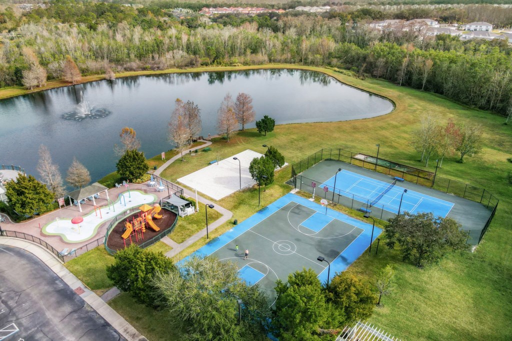 Overview of the resort basketball court, tennis court, sand volley ball court, and kids playground for guest use.