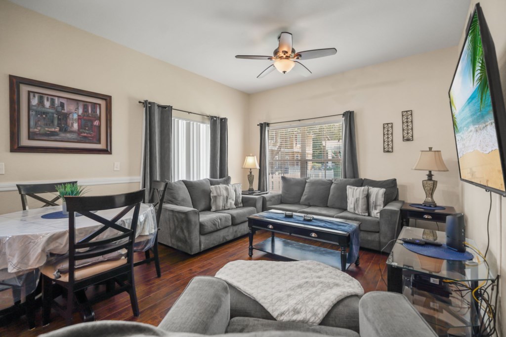 Living room area with Smart TV & dining area.