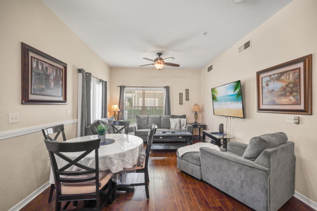 Overview of the living room, Smart TV, & dining area.