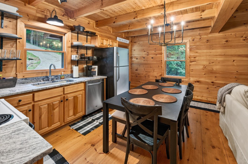 Rustic kitchen with modern amenities and a cozy dining area for family gatherings.