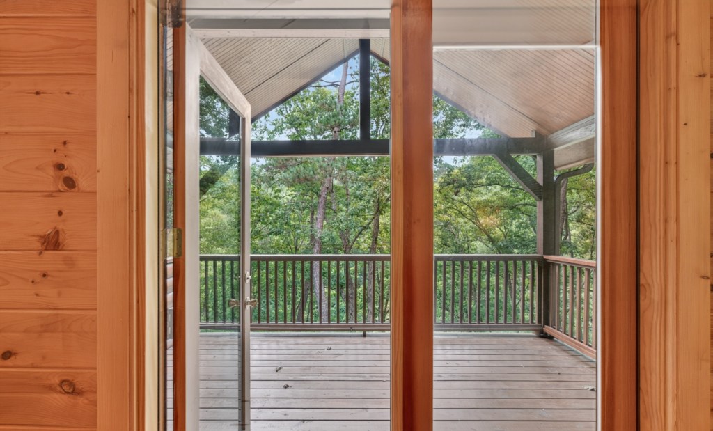 Spacious deck with stunning forest views, perfect for morning coffee or evening relaxation.