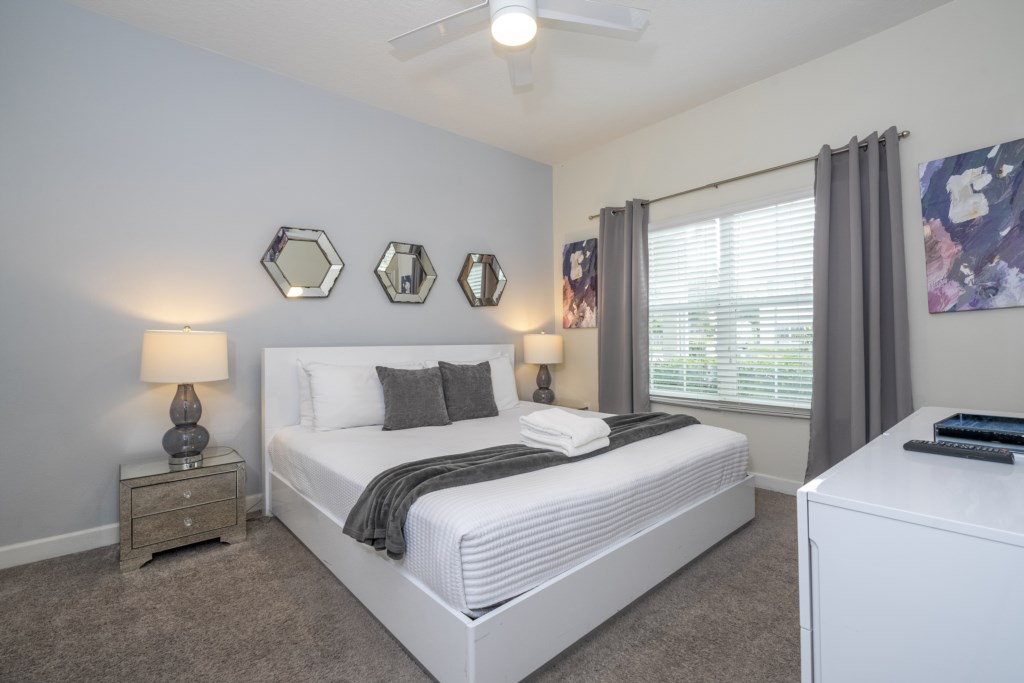 First floor bedroom w/ king size bed and TV