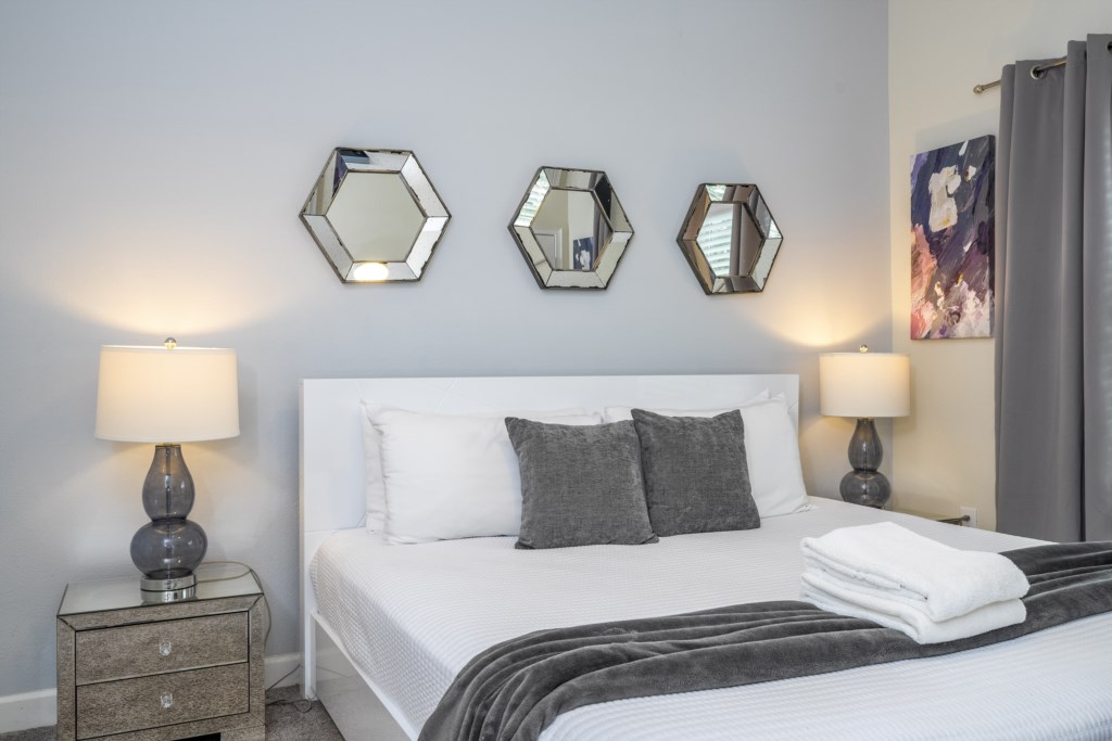 First floor bedroom w/ king size bed and TV