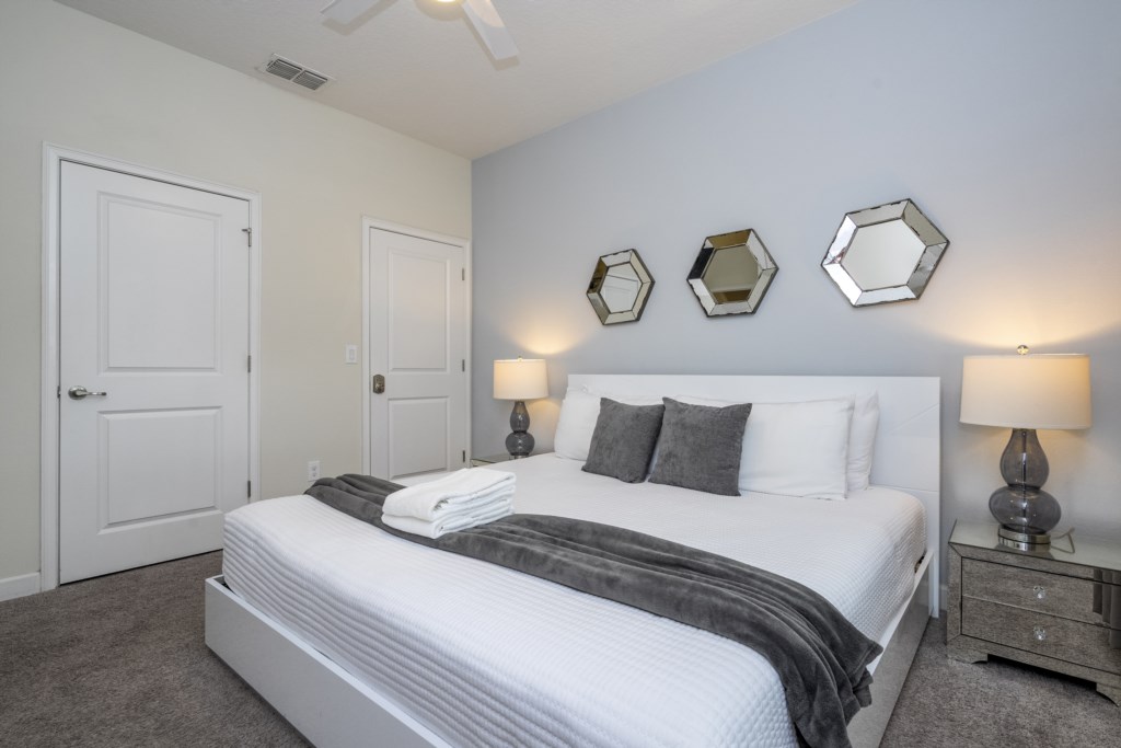 First floor bedroom w/ king size bed and TV