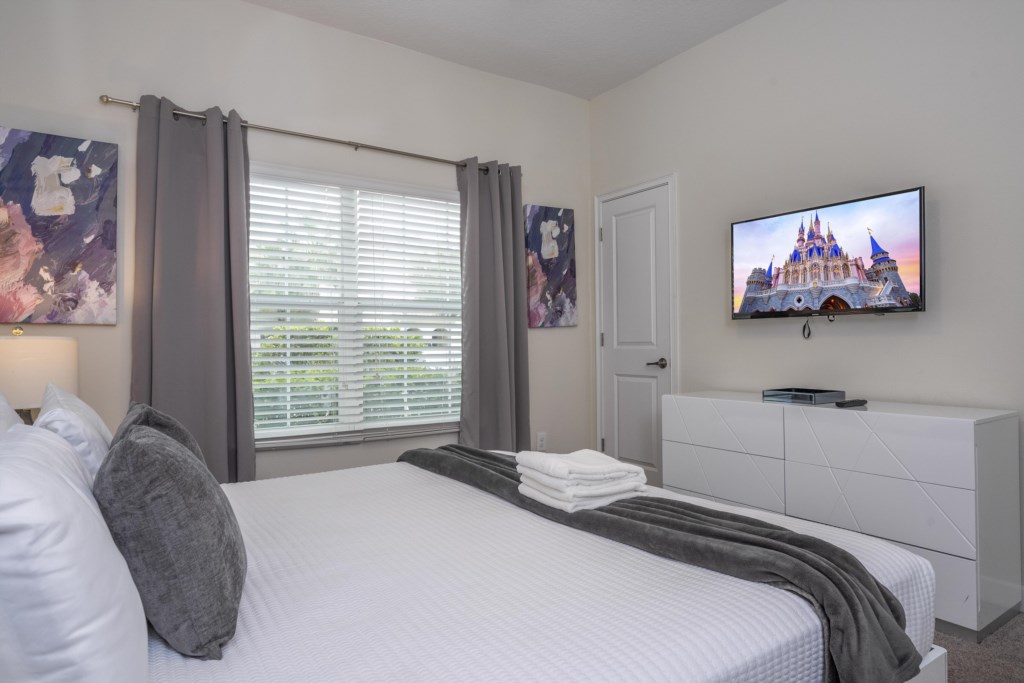 First floor bedroom w/ king size bed and TV