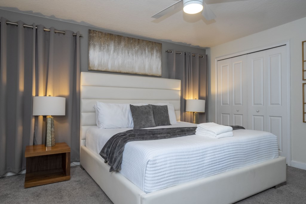 Master suite with a king size bed and TV