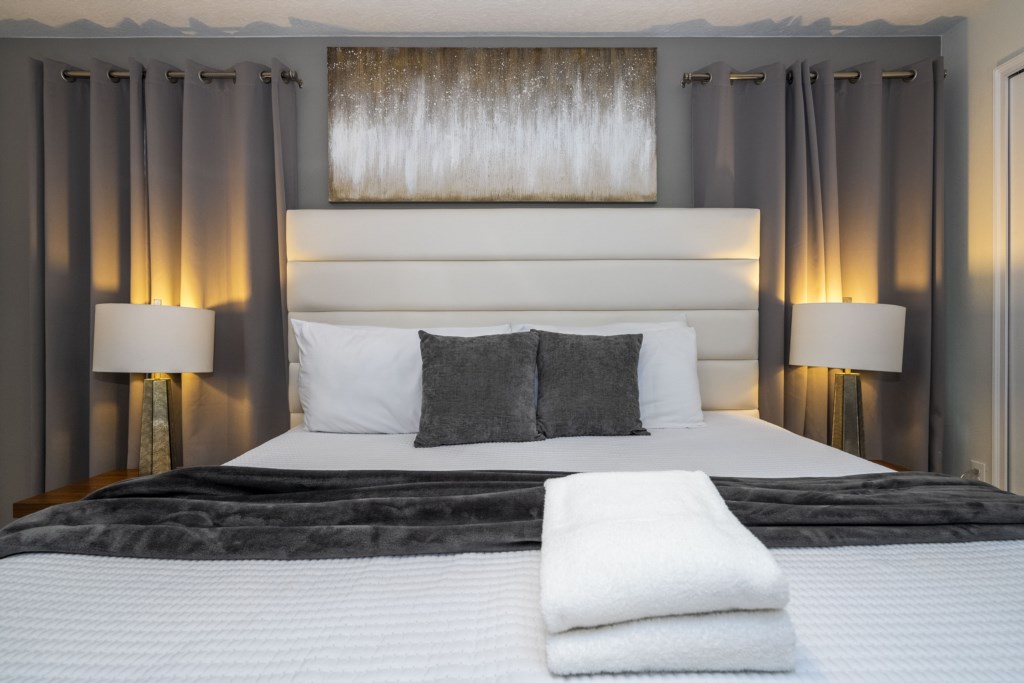 Master suite with a king size bed and TV