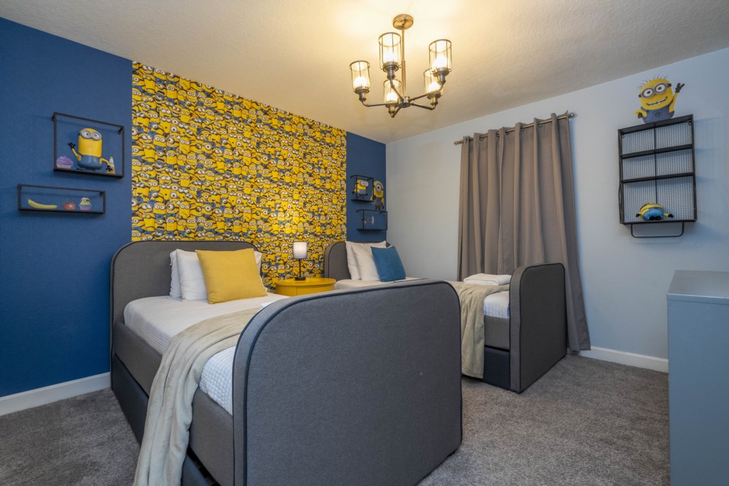 Twin bedroom Minions themed w/ TV