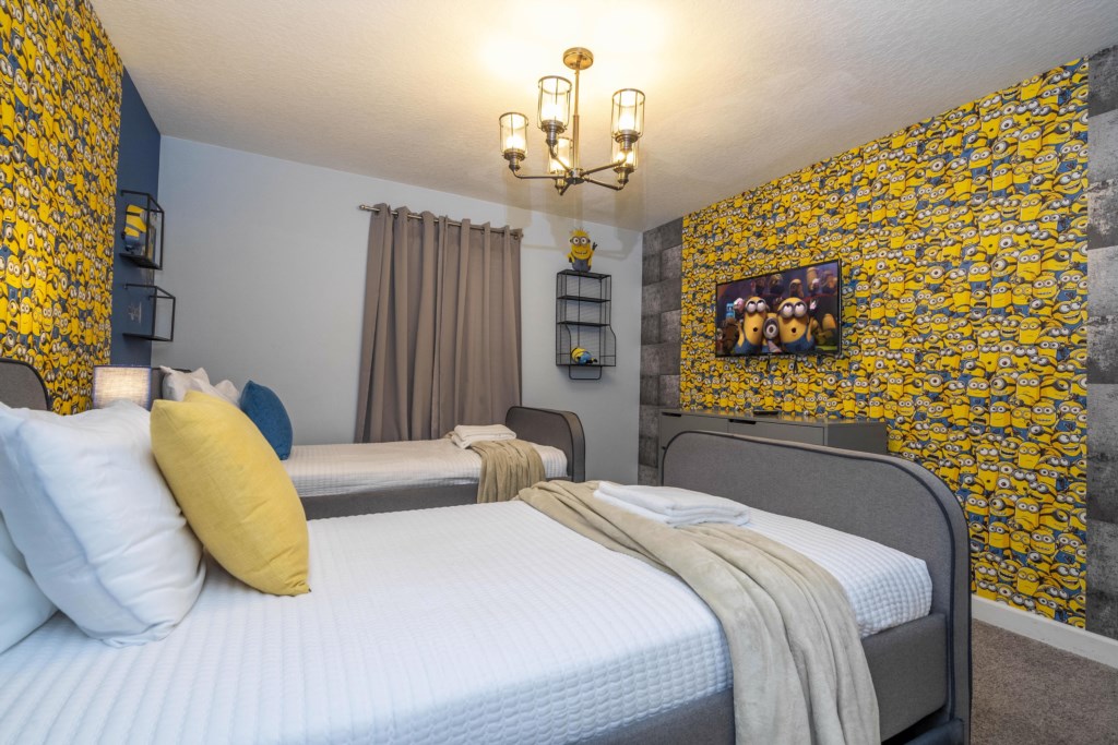 Twin bedroom Minions themed w/ TV