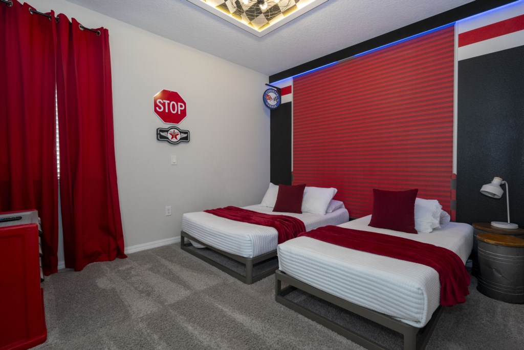 Cars themed bedroom w/ full + twin beds & TV