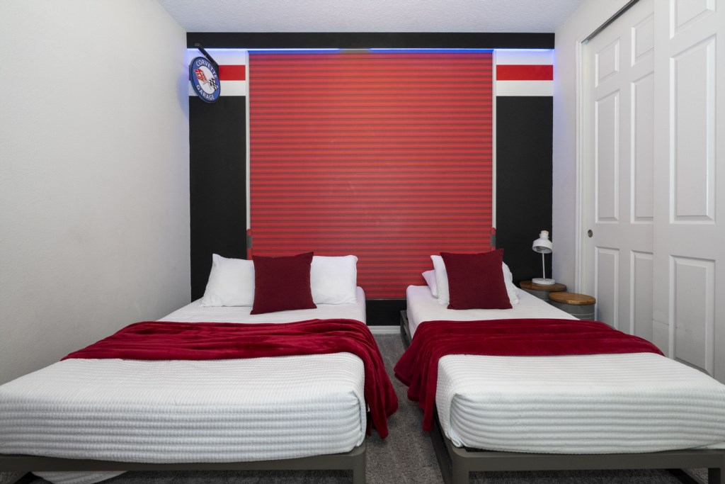 Cars themed bedroom w/ full + twin beds & TV