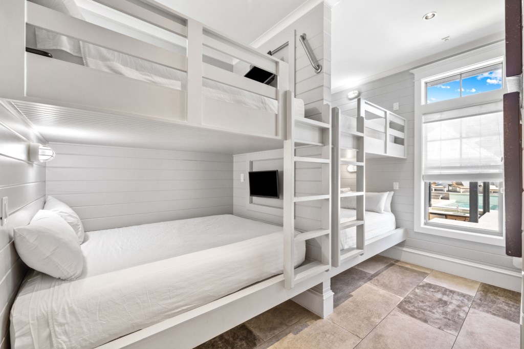 Guest Room With Two Queen-Over-Queen Bunk Beds and Twin-Over-Twin Bunk Bed On 1st Floor