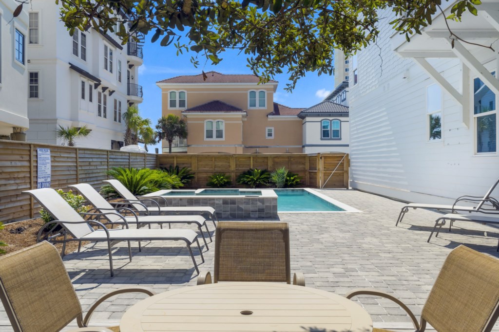 Pool area with dining and lounge chairs