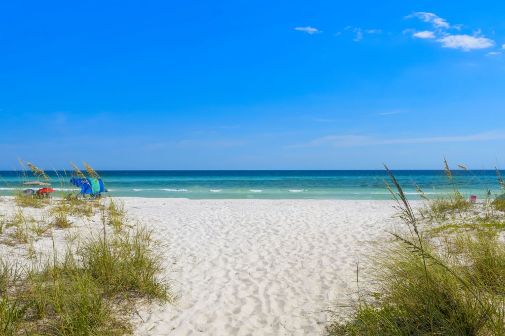 Beautiful White Sands Await You Directly Behind The House